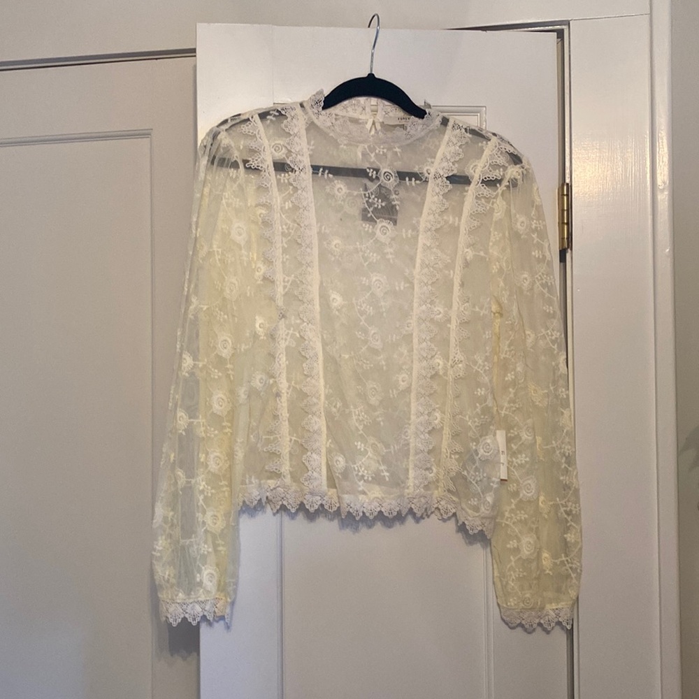 Sheer floral lace blouse with button closure in back